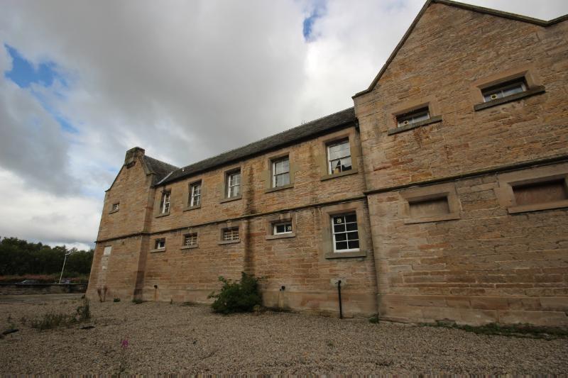 Former prison at Dingwall Sheriff Court, looking east, during daytime on a cloudy day. 