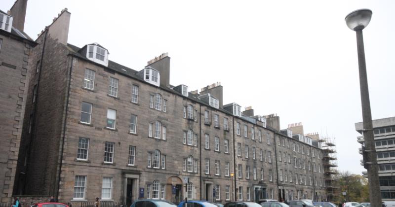 17-25 Buccleuch Place, Edinburgh, north elevation, wide street with cars in foreground, on overcast day.