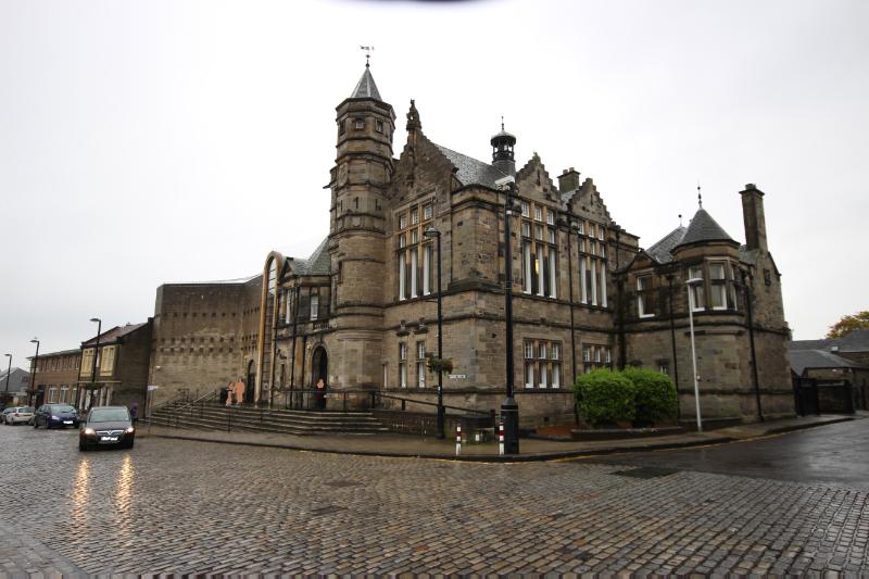 : Kirkcaldy Sheriff Court, principal and northwest elevations, looking south, during daytime on an overcast day. 