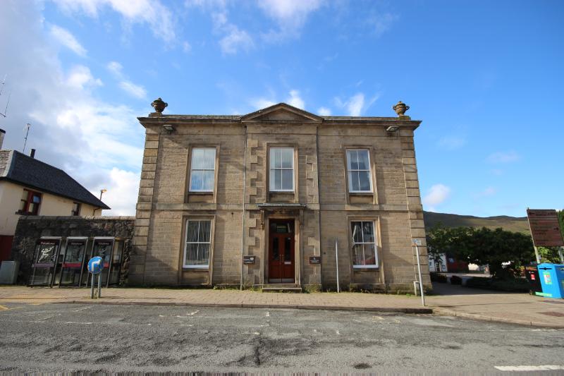 Portree Sheriff Court, principal elevation, looking southwest, during daytime with blue sky