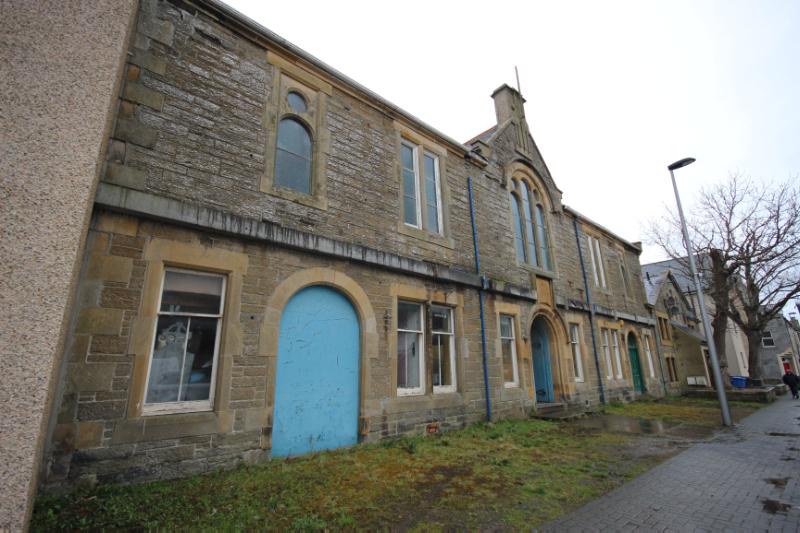 Former Drill Hall, 21 Sinclair Street. Front of building, looking northwest. During daytime on an overcast day.