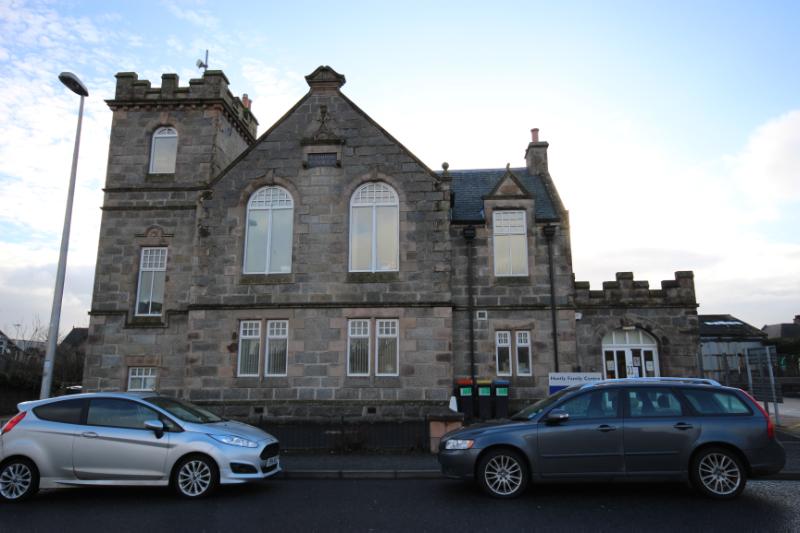 Huntly Family Centre, principal elevation, looking southwest during daytime on clear day with blue sky