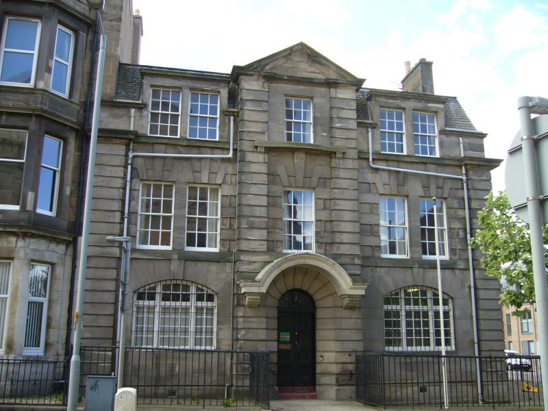 124 McDonald Road, Principal elevation, looking southwest, during daytime on a cloudy day