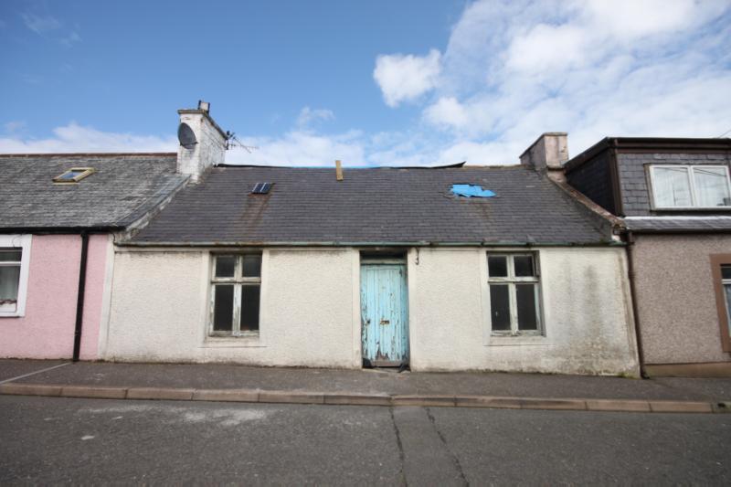 11 Main Street, Kirkcolm, street elevation, during daytime, on clear day with blue sky.