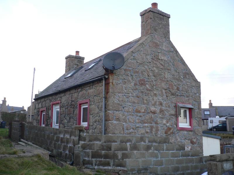 2 Bridge Street, Boddam, south elevation and east gable, looking northwest, during daytime, on an overcast day.