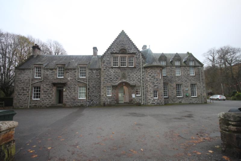 Blair Atholl Village Hall (former Drill Hall), principal elevation, looking south, during daytime with an overcast grey sky. 