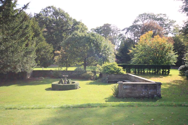 Balbirnie House, formal garden area with Italianesque seating, during daytime
