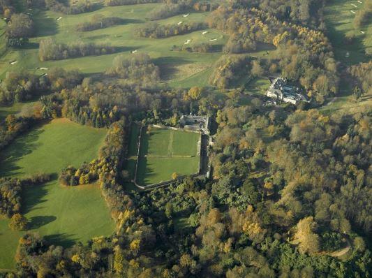 Aerial view of Balbirnie House designed landscape, centred on walled garden, surrounded by trees
