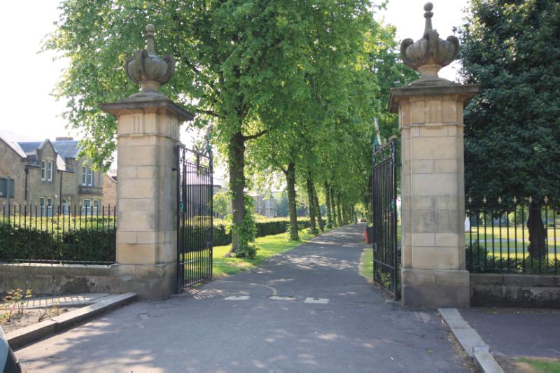 The east park gate section n of the structure, looking south, during daytime with blue sky.