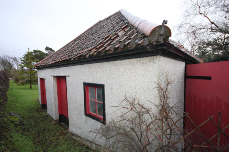 Millbank, principal elevation of outbuilding looking south east on a dull rainy day