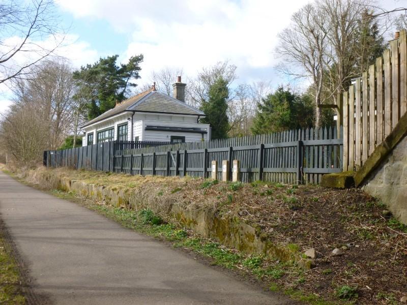Pitfodels Station House, Aberdeen south and east elevations looking northeast on sunny day with blue sky.  