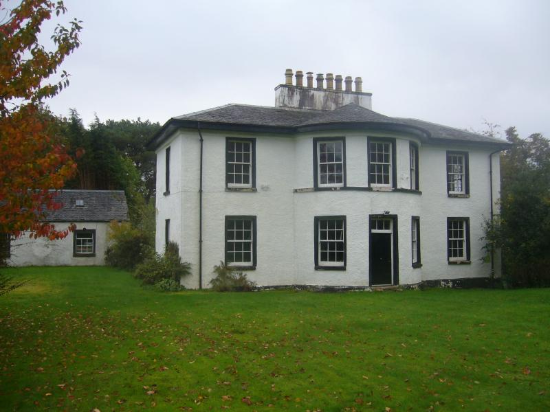 Telford House at Gairlochy, Caledonian Canal, canal side elevation, looking southeast, during daytime on a sunny day. 