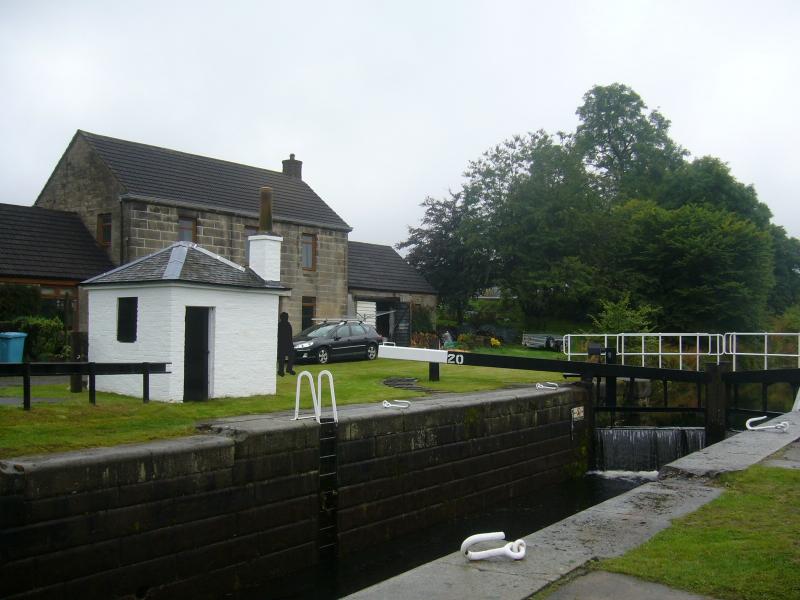 Lock Keeper’s Bothy at Wyndford Lock, Forth and Clyde Canal, canal side elevation, looking southwest, during daytime on a cloudy day.