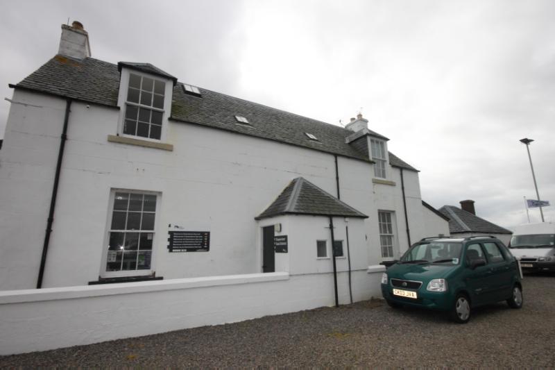 Former Lock Keeper’s Cottage and Bothy at Clachnaharry Sea Lock, Caledonian Canal, during daytime 