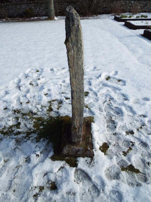 Dunachton Lodge, symbol stone, looking east during daytime on a clear day with snow cover on the ground.