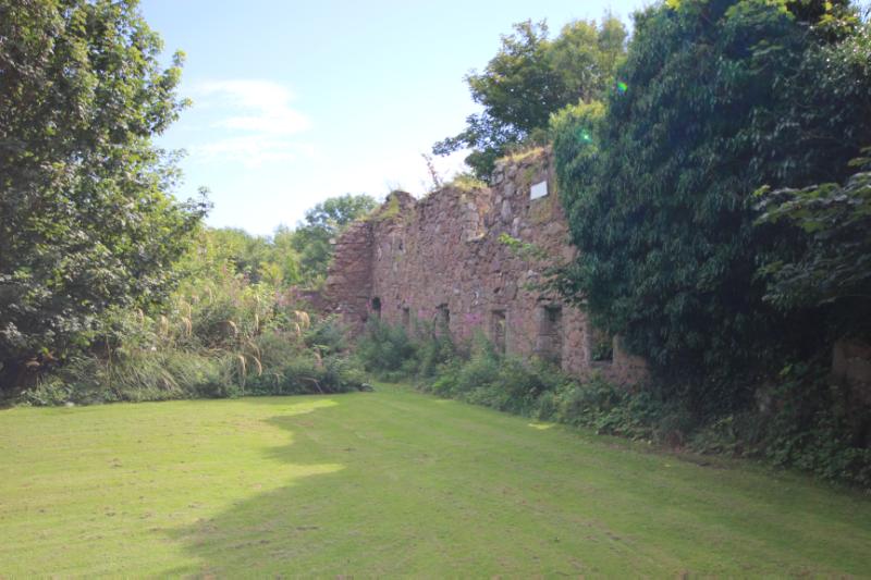 Inverugie Castle, looking east along south range, during daytime with blue sky