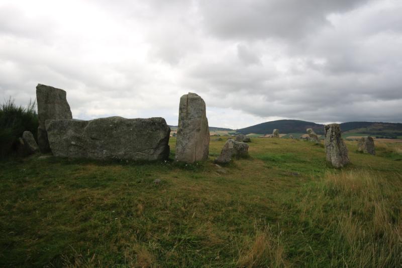 Tomnaverie recumbent stone and flankers, looking north, during daytime with grey sky
