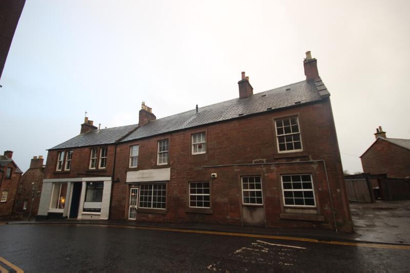 34, 36, 38, 38A, and 40 Glengate, Kirriemuir, principal elevation, looking south, during daytime with a cloudy sky.
