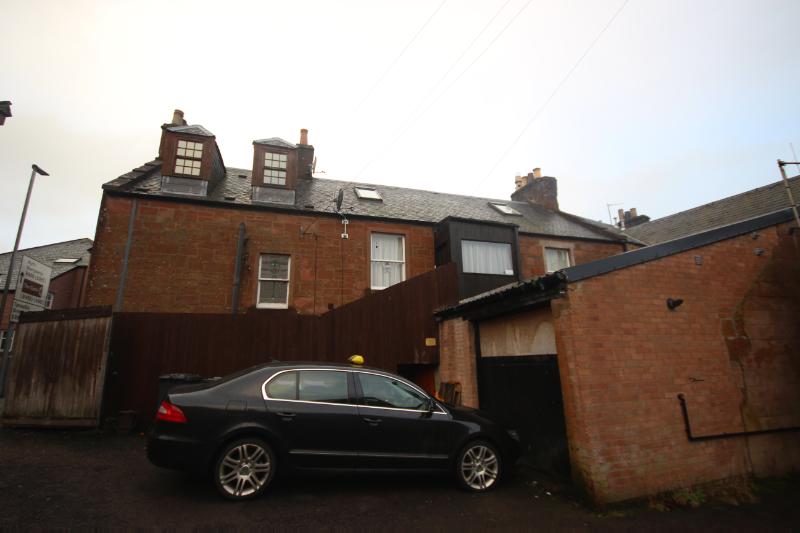 38, 38A, and 40 Glengate, Kirriemuir, rear elevation, looking north, during daytime with a cloudy sky.
