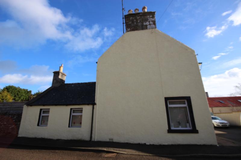 Feranich, Sutherland Street, Helmsdale, looking southeast. during daytime, on clear day with blue sky.