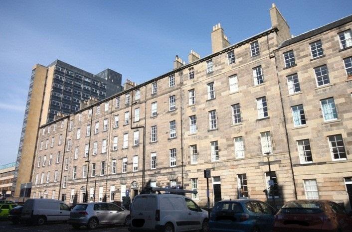 Southeast elevation, 30-35 Buccleuch Place, Edinburgh, with cars in foreground.