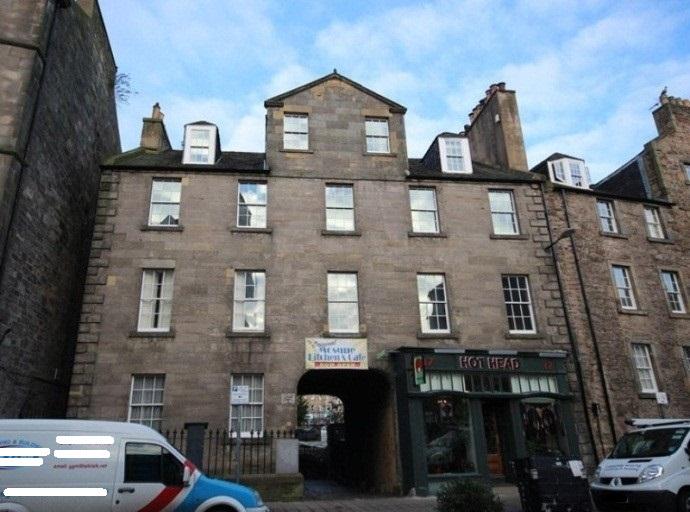 South elevation, 17-19 West Nicolson Street, Edinburgh, vehicles in foreground.