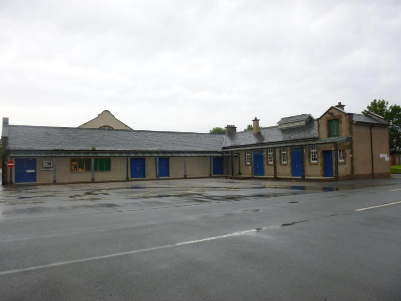 Store building, Redford infantry barracks, Colinton Road, Edinburgh, courtyard elevation to south, during daytime on rainy day with grey sky.