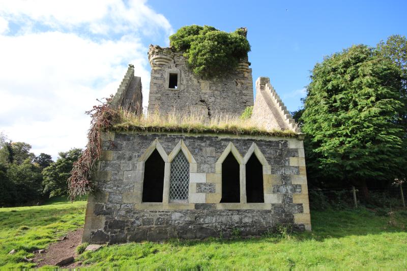Later addition to the west of Mountquhanie Castle showing four pointed arch windows, taken on a cloudy day.