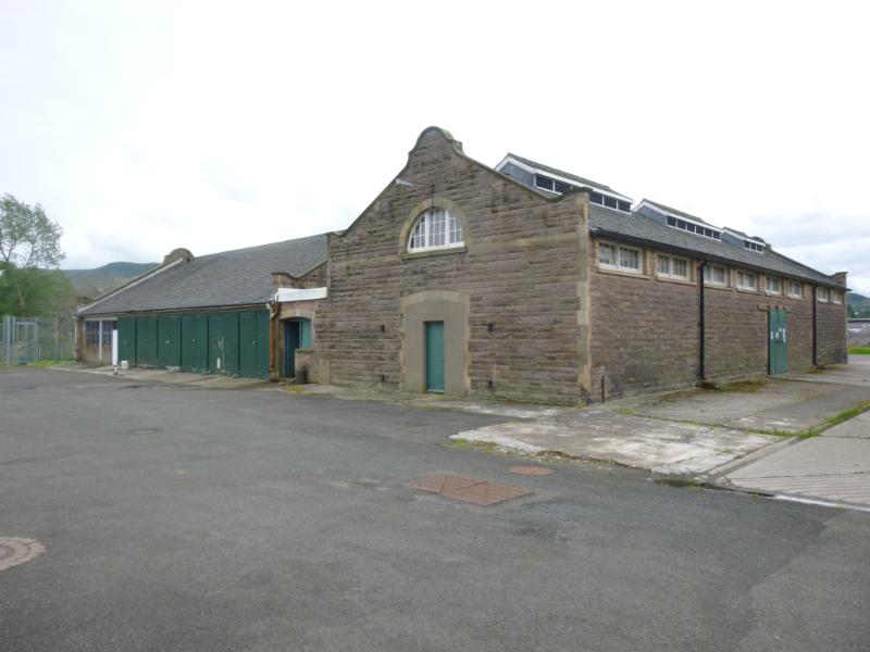 Building 26 and 28, Redford cavalry barracks, Colinton Road, Edinburgh, looking southwest, during daytime on dull day with cloudy sky and road in front. 
