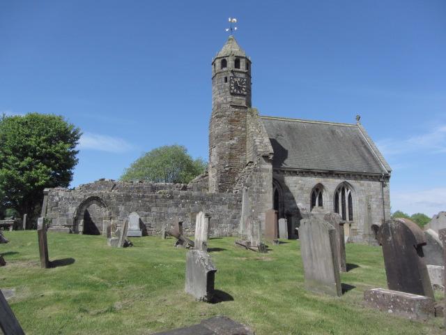 St Bride's Church, looking north from the graveyard, during daytime with blue sky