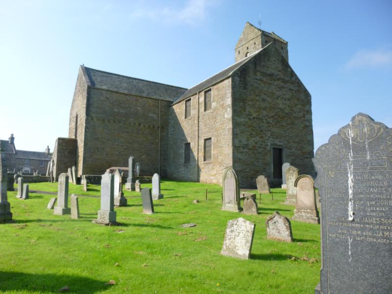 St Serf's Church, view across graveyard to church, looking southwest, during daytime, on a clear day with blue sky.