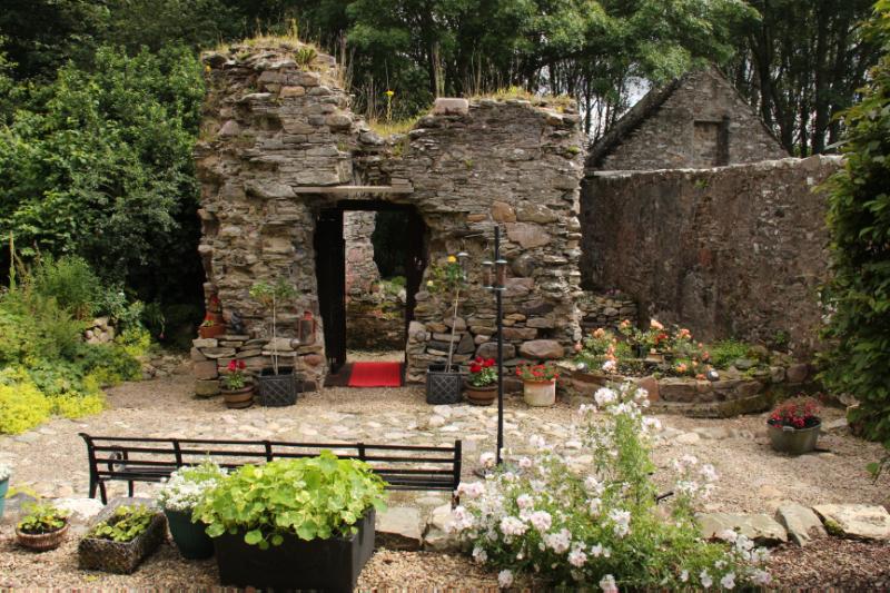 Tower of Deskford, west face and adjacent church.