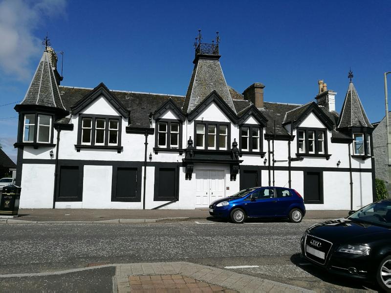 Blackford Hotel, principal elevation, looking northwest, on clear day with blue sky.