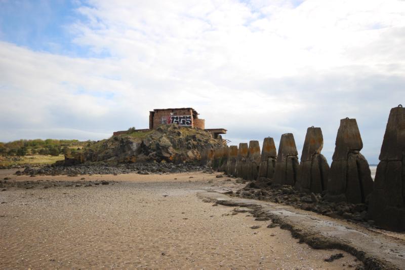 Cramond Island, view of anti-shipping barrier and defences on The Knoll looking north-northeast, during daytime, on partly sunny day. 