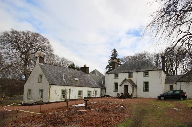 Scots Mining Company House, principal elevations looking northeast during daytime with partly cloudy sky