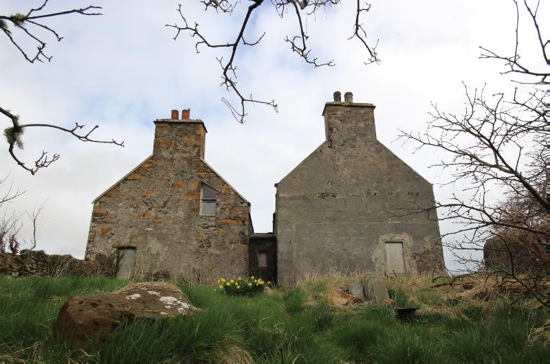 Halligarth House, southwest elevation showing link during daytime with partly cloudy sky.