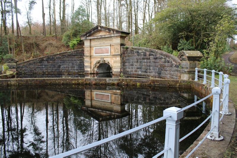 Craigmaddie gauge basin and pedimented architrave –reflecting water below.