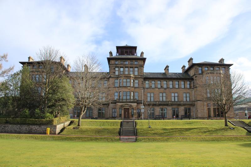 Former Craiglockhart Hydropathic, principal elevation, looking east, during daytime, on clear day with blue sky.