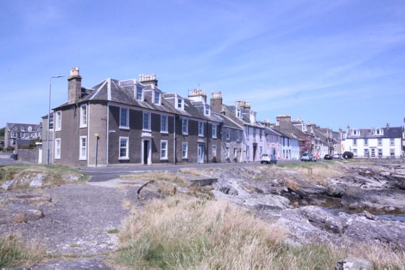 12-28 Crichton Street, principal elevations, looking north from jetty, during daytime, on sunny day with blue sky.