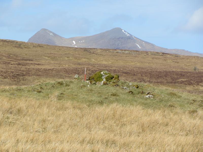 Cromalt, chambered cairn 1150m NNW of from the east with Cul Mor in the background taken on a clear day. 