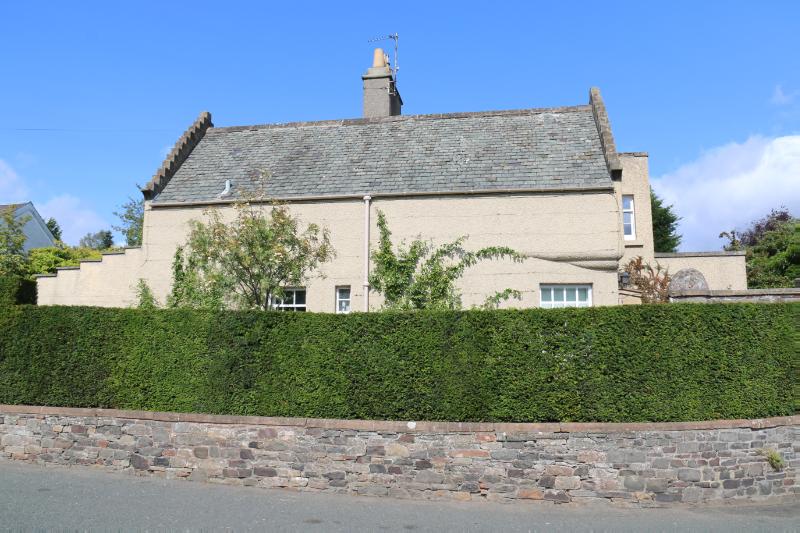 Braehead Lodge, principal elevation, looking north, during daytime, on clear day with blue sky.