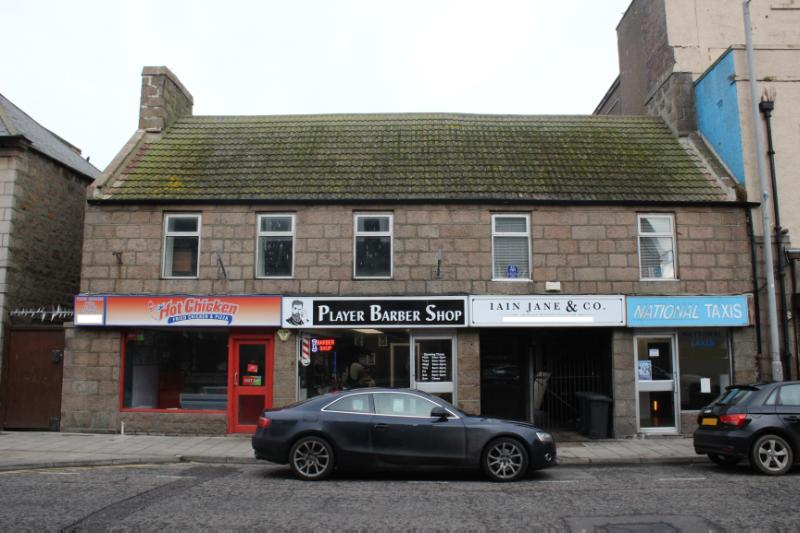 30-34 Queen Street, Peterhead, principal elevation, looking northeast, during daytime, on overcast day. 