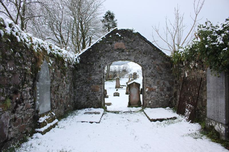 MacDougall burial aisle, Kilbride Chapel, looking west, during daytime, on a snowy day