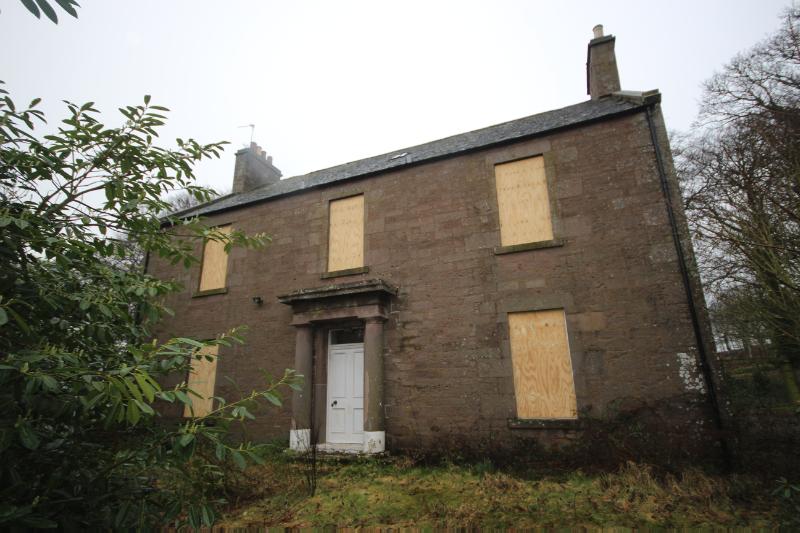 : Leuchland Farmhouse, principal elevation, looking northwest, with rhododendron bush to the left, during daytime. 