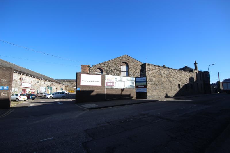 Former Edinburgh and Leith gasworks, view of Baltic Street elevation and entrance, looking north, during daytime, on clear day with blue sky. 