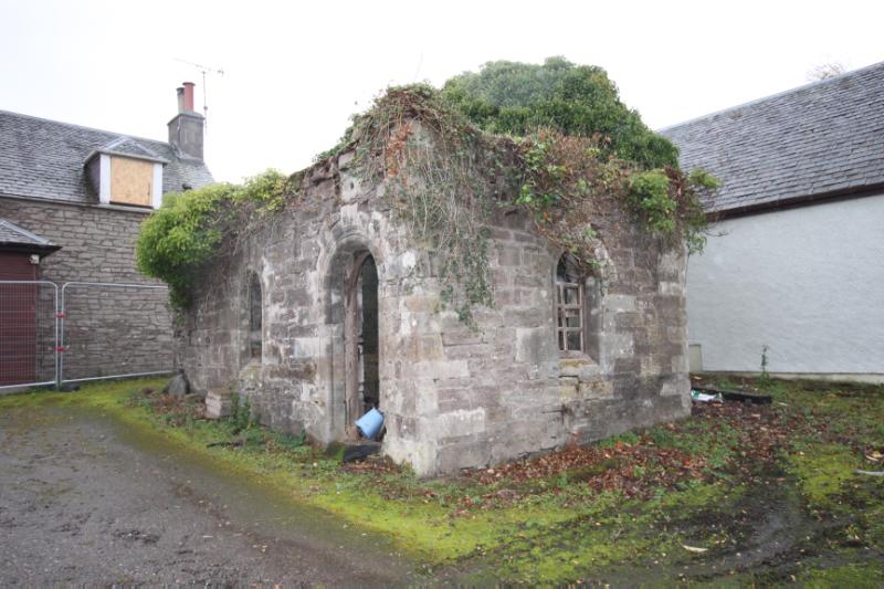 Castellated building (Auchterarder Castle) at Castlemains, Auchterarder, east and north elevations, looking southwest on a cloudy day.