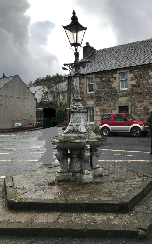 Fintry Fountain, looking south, during daytime on a grey day. 