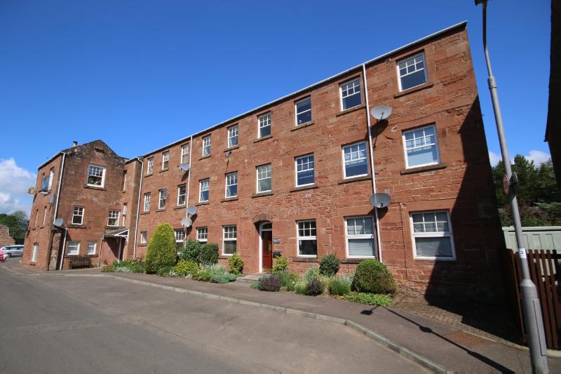 1-12 Thomson’s Mill, principal elevation, looking north, during daytime, on clear day with blue sky. 