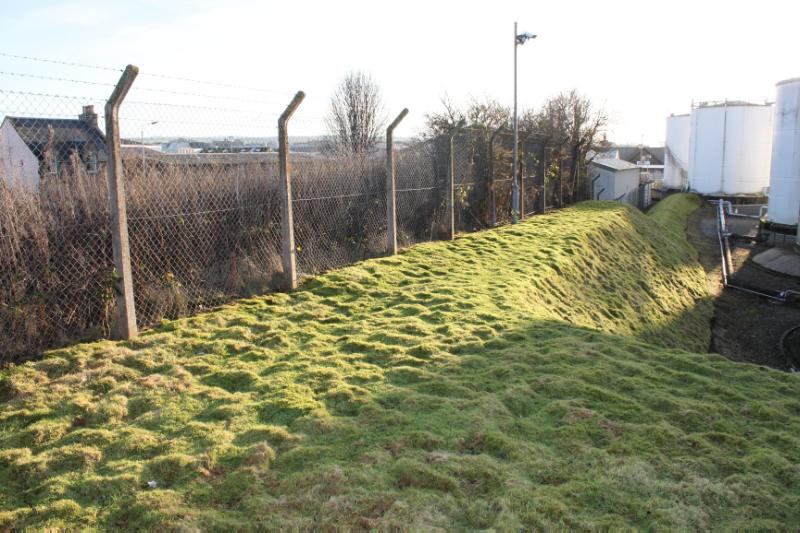 Remains of Cromwell’s Fort, view across bastion platform and rampart, looking south, on a clear sunny day.