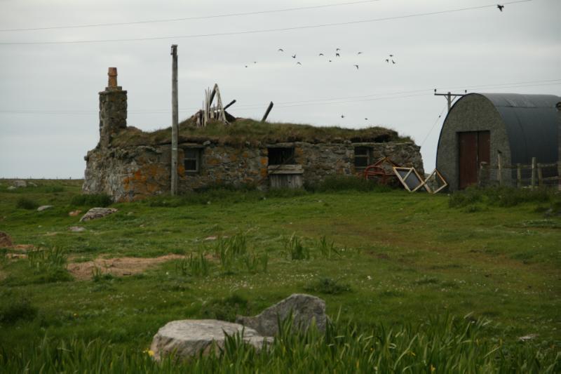 South Smerclate Thatched Cottage, east elevation, looking west, during daytime on overcast day.